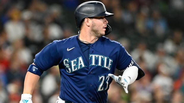 Mariners first baseman Ty France (23) runs to first base after hitting a single during the fifth inning of a game against the Angels.